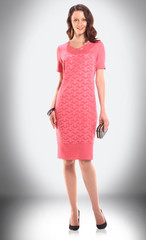 charming woman model in red knitted dress