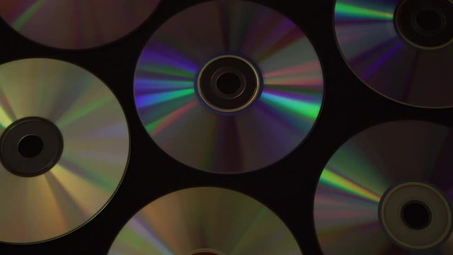 Vintage CD or DVD disk background, old circle discs used for data storage, share movies and music