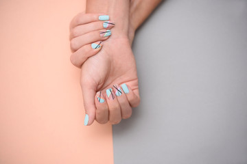 Beautiful well-groomed, accurate hands with summer manicure