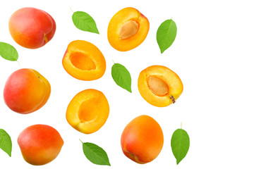 apricot fruits with slices and green leaf isolated on white background. top view