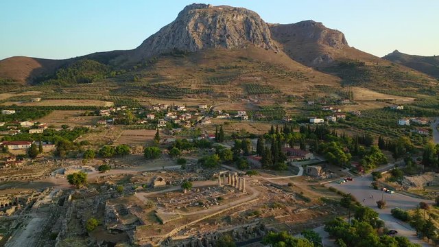 Aerial drone panoramic view video of historic uphill medieval castle of Acrocorinth an ancient citadel overlooking ancient Corinth with breathtaking view, Peloponnese, Greece