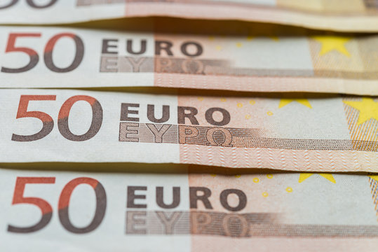 Close up of euro currency, bills of 50 euros. Concept of finance, business, banking, debt, and European Union.