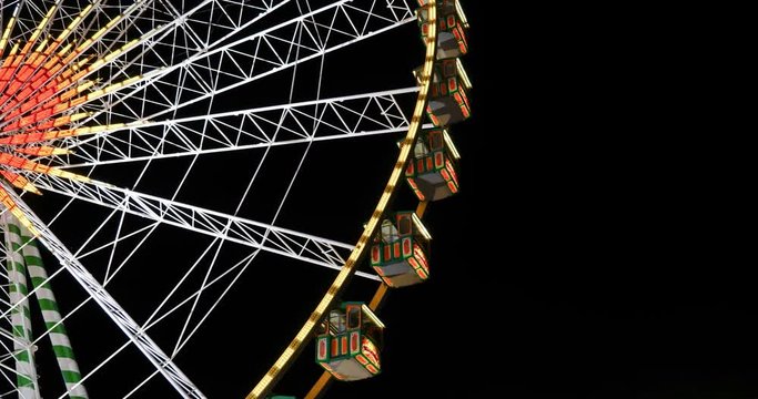 Close up view of colourful illuminating spinning" Bellevue " Ferris wheel, iconic giant wheel of annual  Rheinkirmes funfair festival, on background of night sky in D&uuml;sseldorf, Germany.