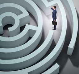 Businessman is trying to escape from maze labyrinth