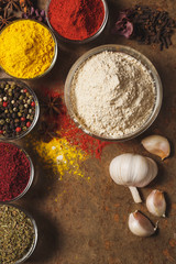 Dried Garlic. Place for text. Different types of Spices in a bowl on a stone background. The view from the top