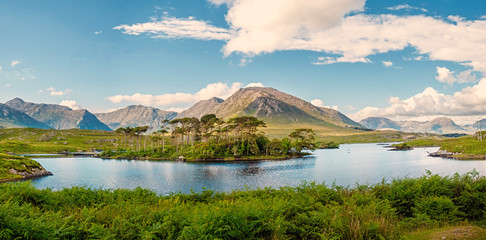 Derryclare Lough, Twelve Pines landscape, Panorama image, Sunny warm day, Cloudy sky, County Galway...