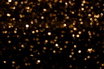 golden blur texture in black contrast