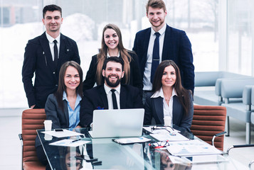 success concept in business - a professional business team in the workplace in the office