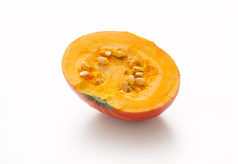 Half Pumpkin with seeds isolated on white background