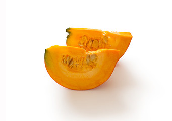 Pumpkin slices with seeds isolated on white background