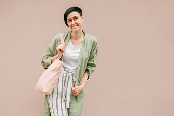 Young woman with eco bag enjoying morning. Eco friendly concept. .