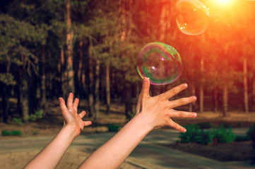 soap bubbles into the sunset with beautiful bokeh.close-up