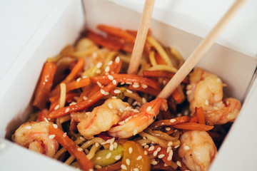 Fry noodles - traditional Chinese WOK with fried chicken, udon and vegetables, close up