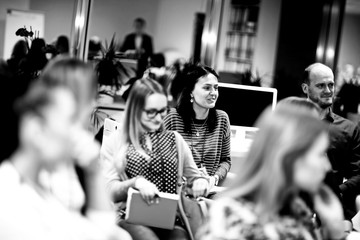 group of women listening to a lecture at a business seminar