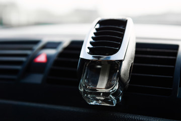 Perfume in a glass jar for cars. Fresh smell in the car