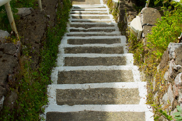 Stone stairs with white striped edges