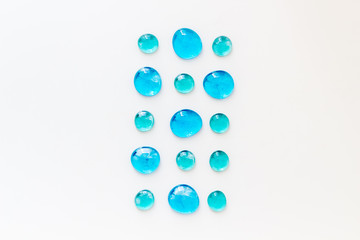 Glass stones for design and home creativity on white background top view