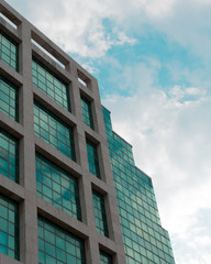 modern office building with blue sky and clouds