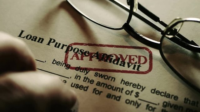 Finger tapping on loan purpose affidavit form