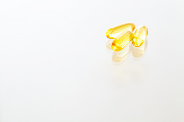 Vitamins supplements, fish oil in yellow capsules omega 3.