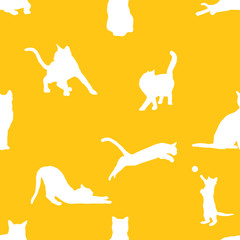 Seamless yellow and white cute cats silhouettes in various positions pattern vector