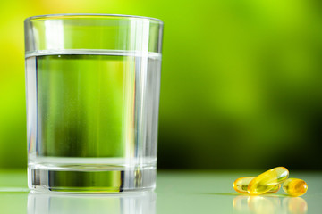 Vitamins supplements, fish oil in yellow capsules omega 3.