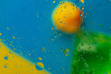 Micro molecular abstract pattern of colored oil bubbles on water. 