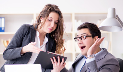 Sexual harassment concept with man and woman in office