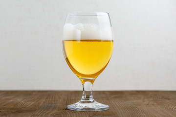 Glass of beer on a wooden table