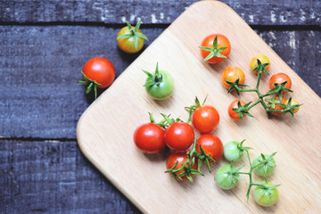 Tomato organic - Ripe red tomatoes on wooden background