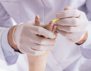 Police coroner examining dead body corpse in morgue