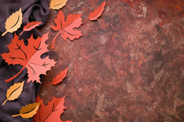 Autumn time, flat lay on dark textured background with paper Autumn leaves