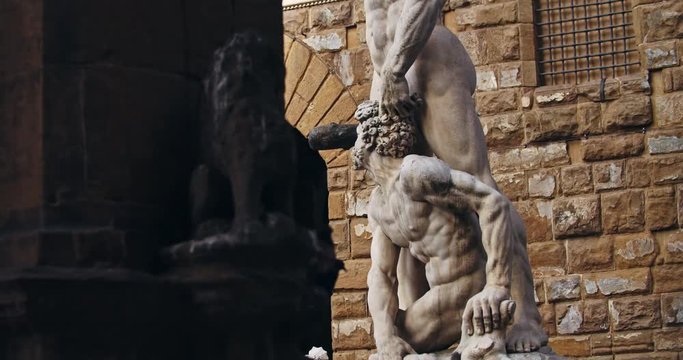 Beautiful Hercules roman statue in the middle of Piazza della Signoria. Walking around famous square in Florence. Unique sculpture artwork outdoors.