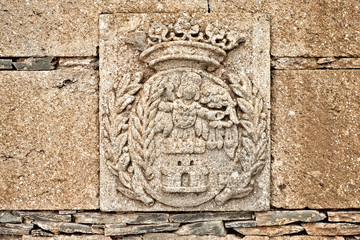 City emblem / coat of arms in stone relief, Medieval decorative art.