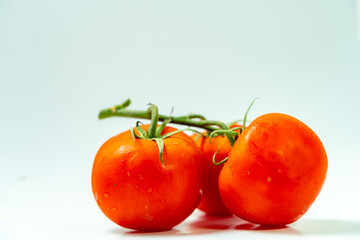Fresh  tomatoes isolated on white background.	
