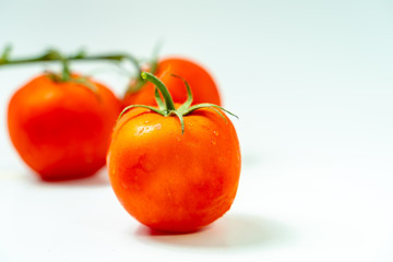 Fresh  tomatoes isolated on white background.	