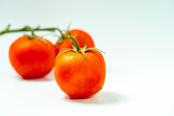 Fresh  tomatoes isolated on white background.	