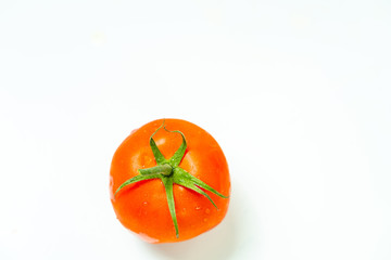 Fresh red tomato with green leaves isolated on white background Clipping Path. Full depth of field.
