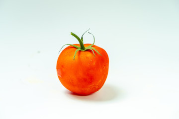 Fresh tomatoes isolated on white background.	