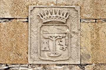 City emblem / coat of arms in stone relief, Medieval decorative art.