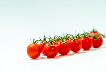 Fresh cherry tomatoes isolated on white background. 