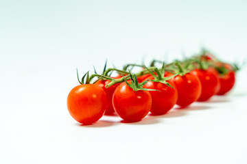 Fresh cherry tomatoes isolated on white background. 