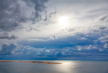 Fototapeta na wymiar beauty world with sun and clouds over Atlantic Ocean