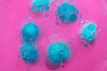 Abstract macro molecular pattern of colored oil bubbles on water. 