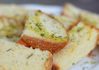 Italian toasted bread with sesamy seeds, olive oil and herbs. Very selective focus