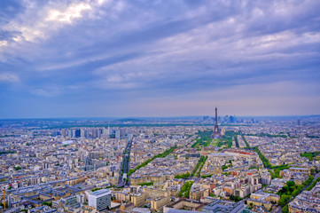 An aerial view of the Eiffel Tower and Paris, France at dusk..