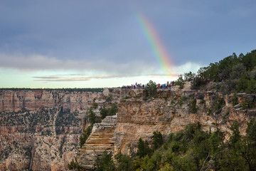 Beatyful Rainbow in Gran Canyon National Park with a dark cloudy sky