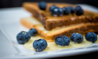 toast with blueberries and honey for breakfast
