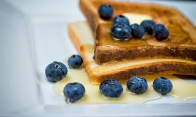 toast with blueberries and honey for breakfast