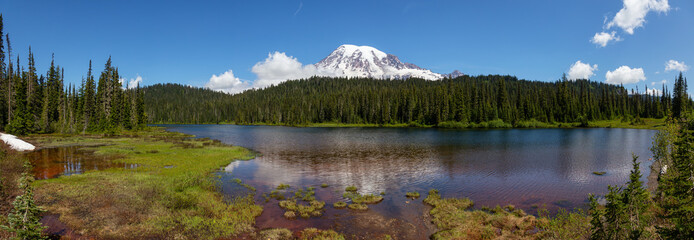 Beautiful Panoramic View of Reflection Lake with Mt Rainier in the background during a sunny summer day. Taken in Paradise, Mt Rainier National Park, Washington, United States of America.